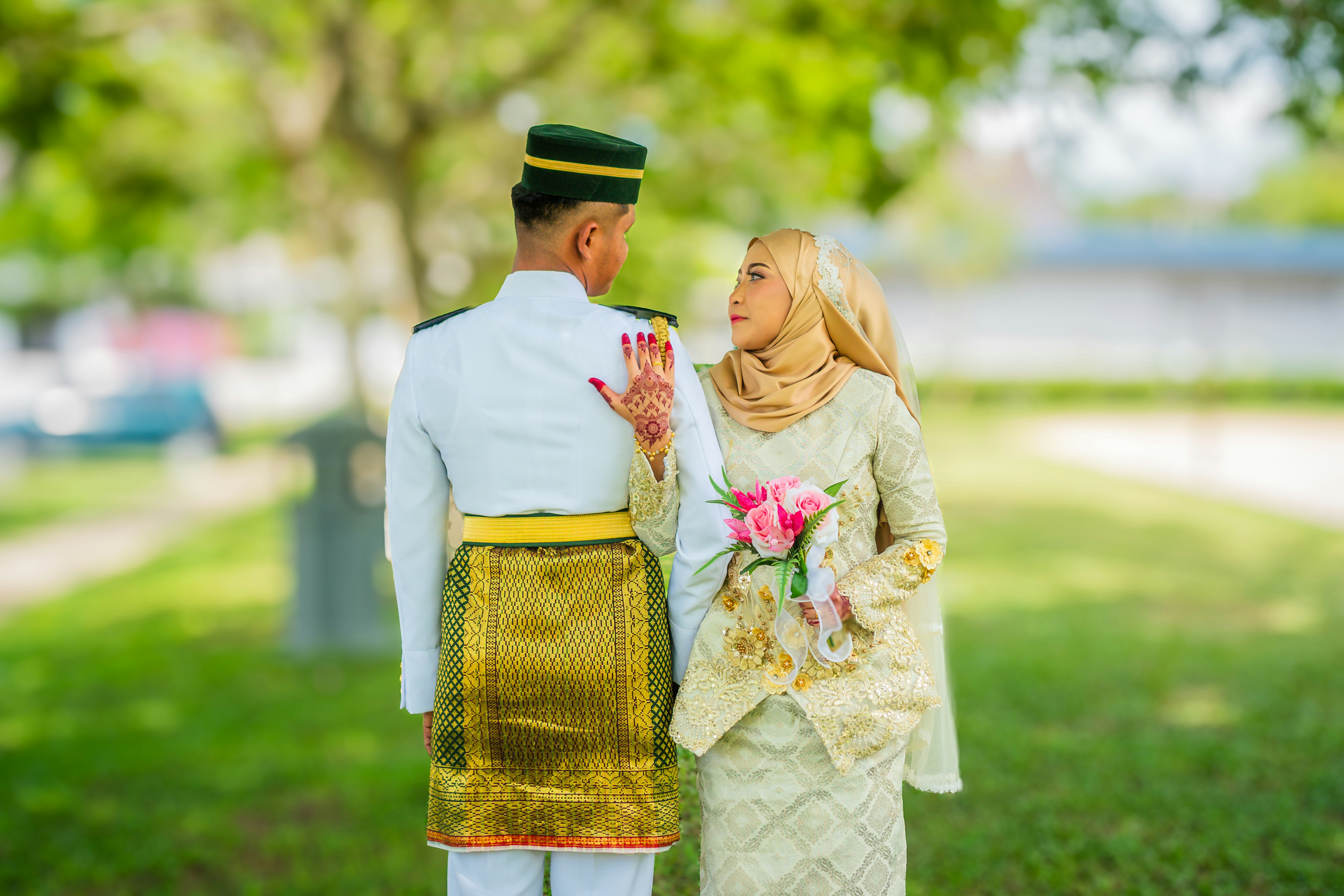 a man and a woman dressed in traditional garb