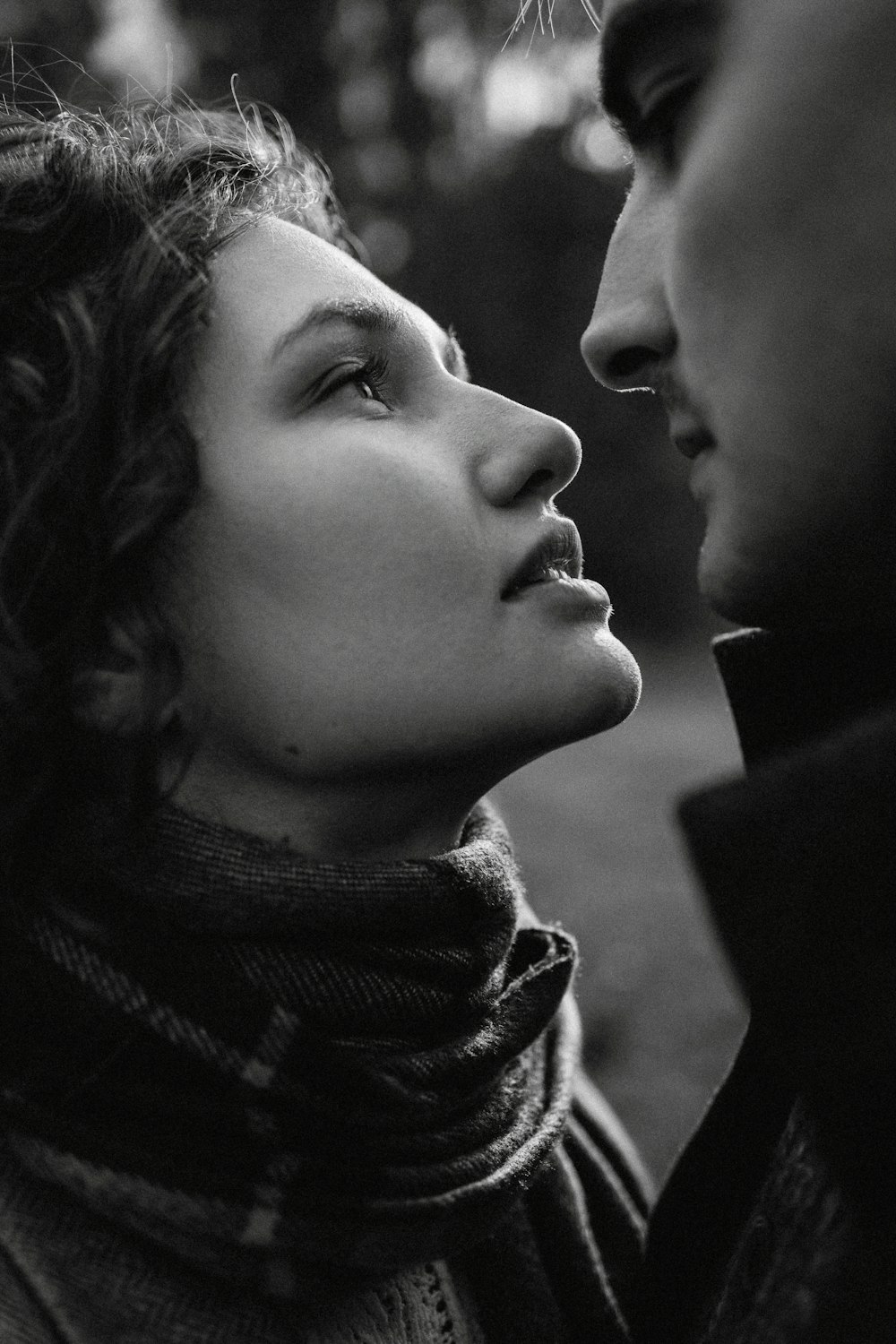 a black and white photo of a man and a woman