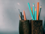 a cup that has some pencils in it