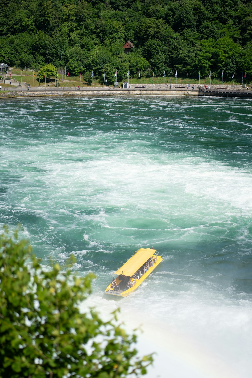 a yellow surfboard in the middle of a river