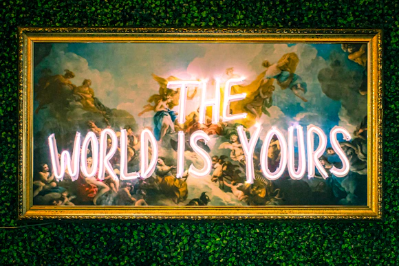 a neon sign that reads the world is yours