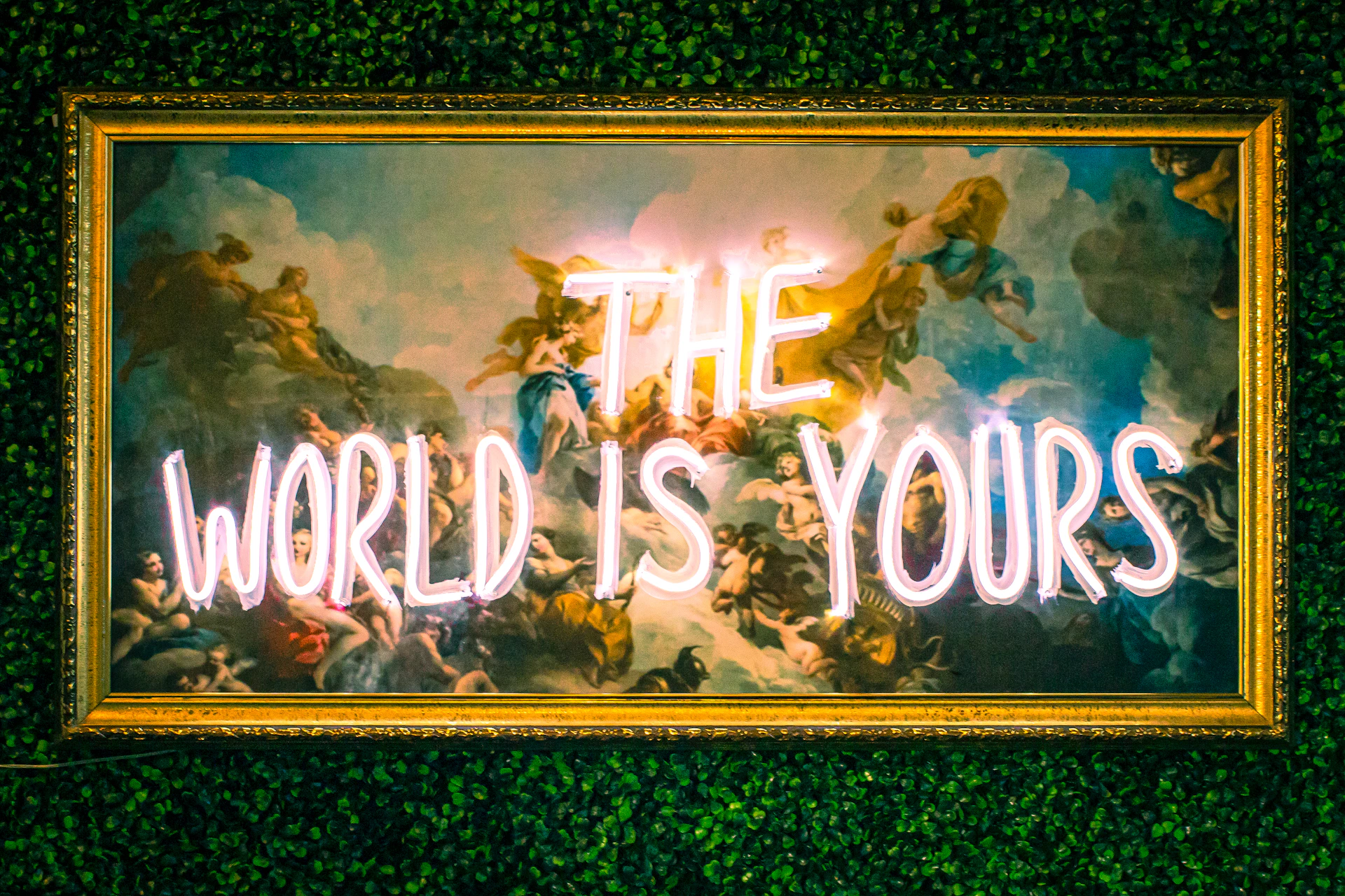 a neon sign that reads the world is yours