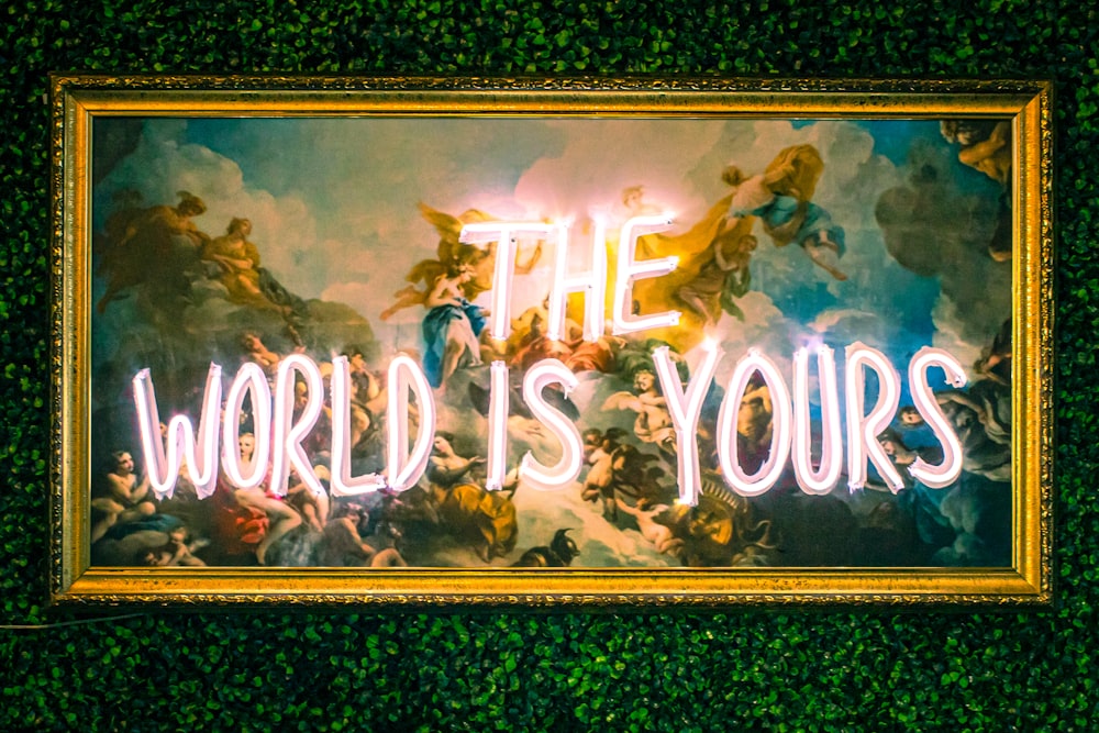 a neon sign that reads the world is yours