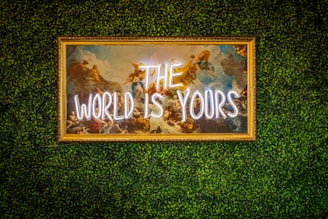 a sign that says the world is yours on a wall