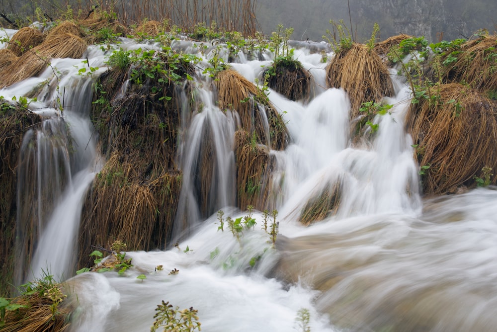 a small waterfall with lots of water running down it