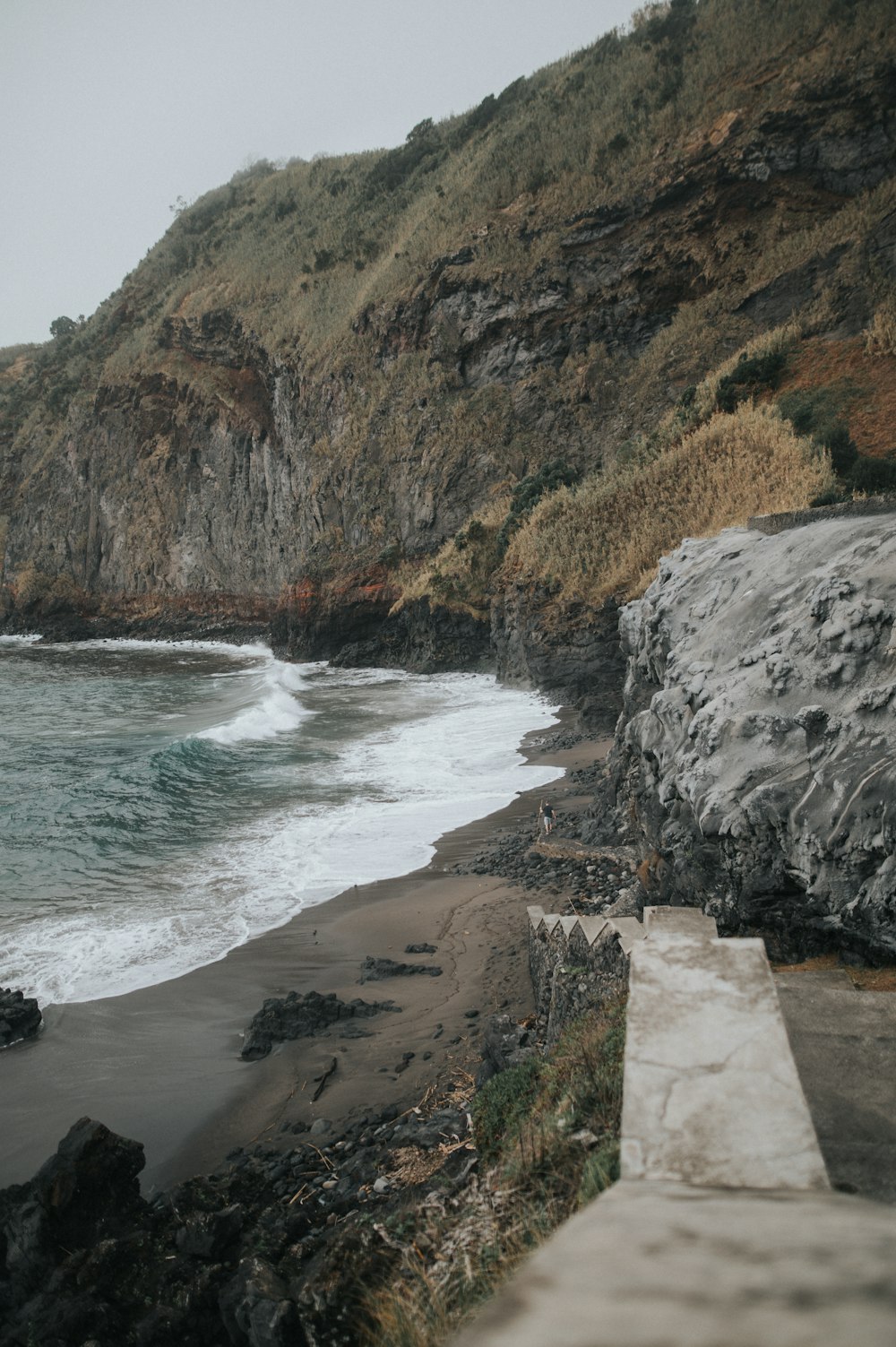 a view of the ocean from a rocky cliff