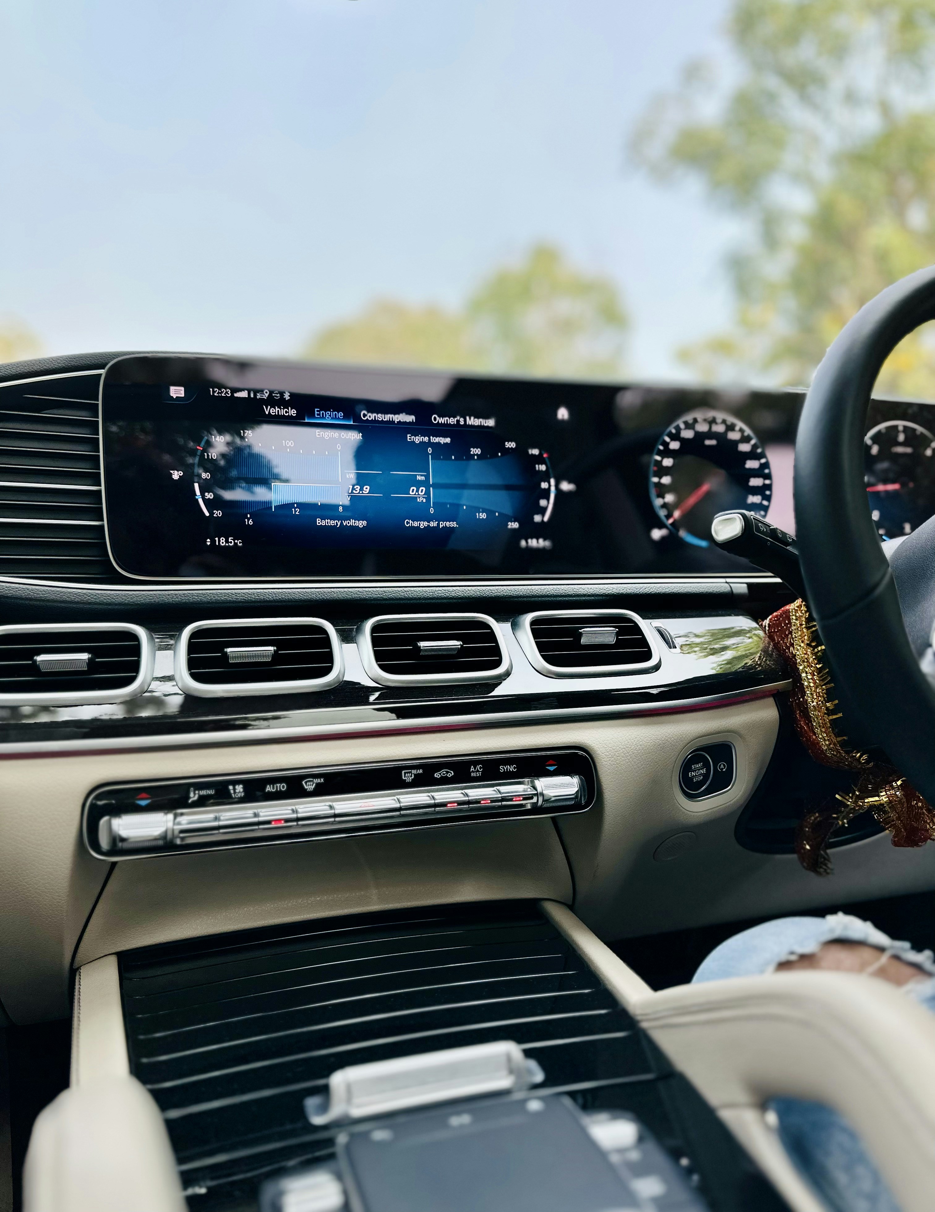 Car air conditioning vent blowing cool air inside a modern vehicle interior
