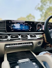 a car dashboard with a steering wheel and a dash board