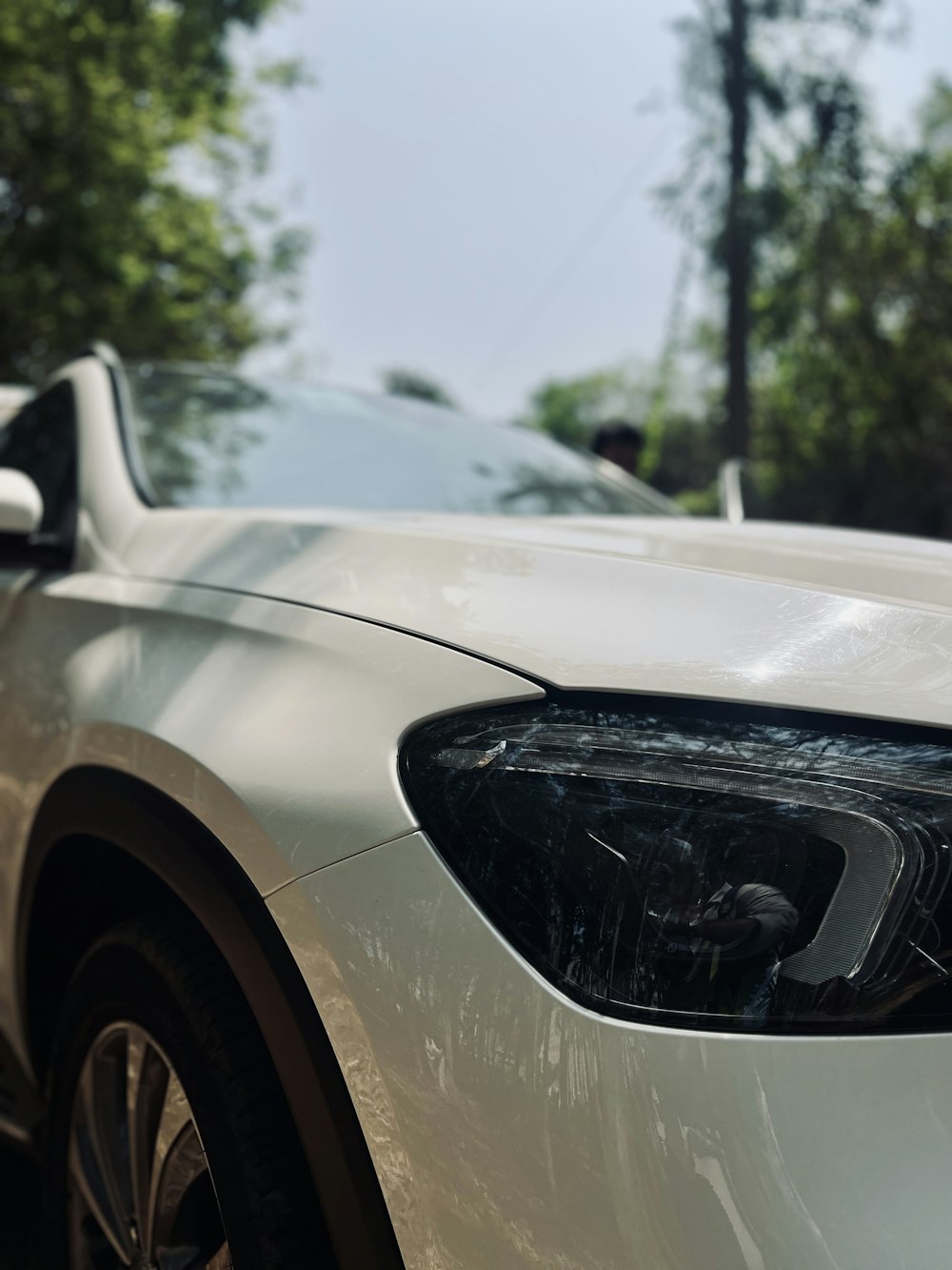 a close up of the front of a white car