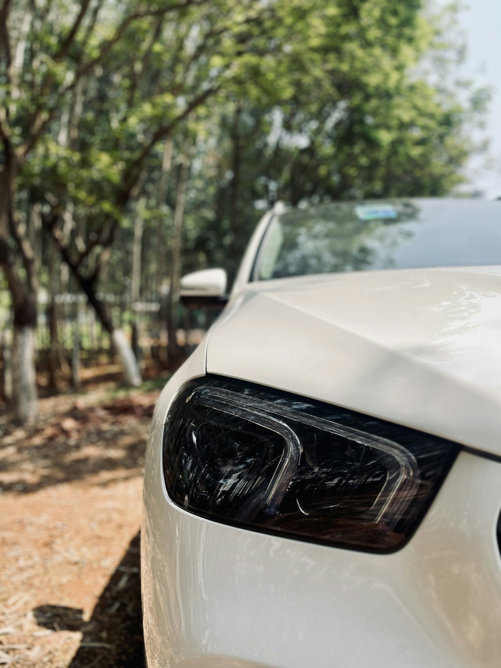 a white car parked on the side of the road