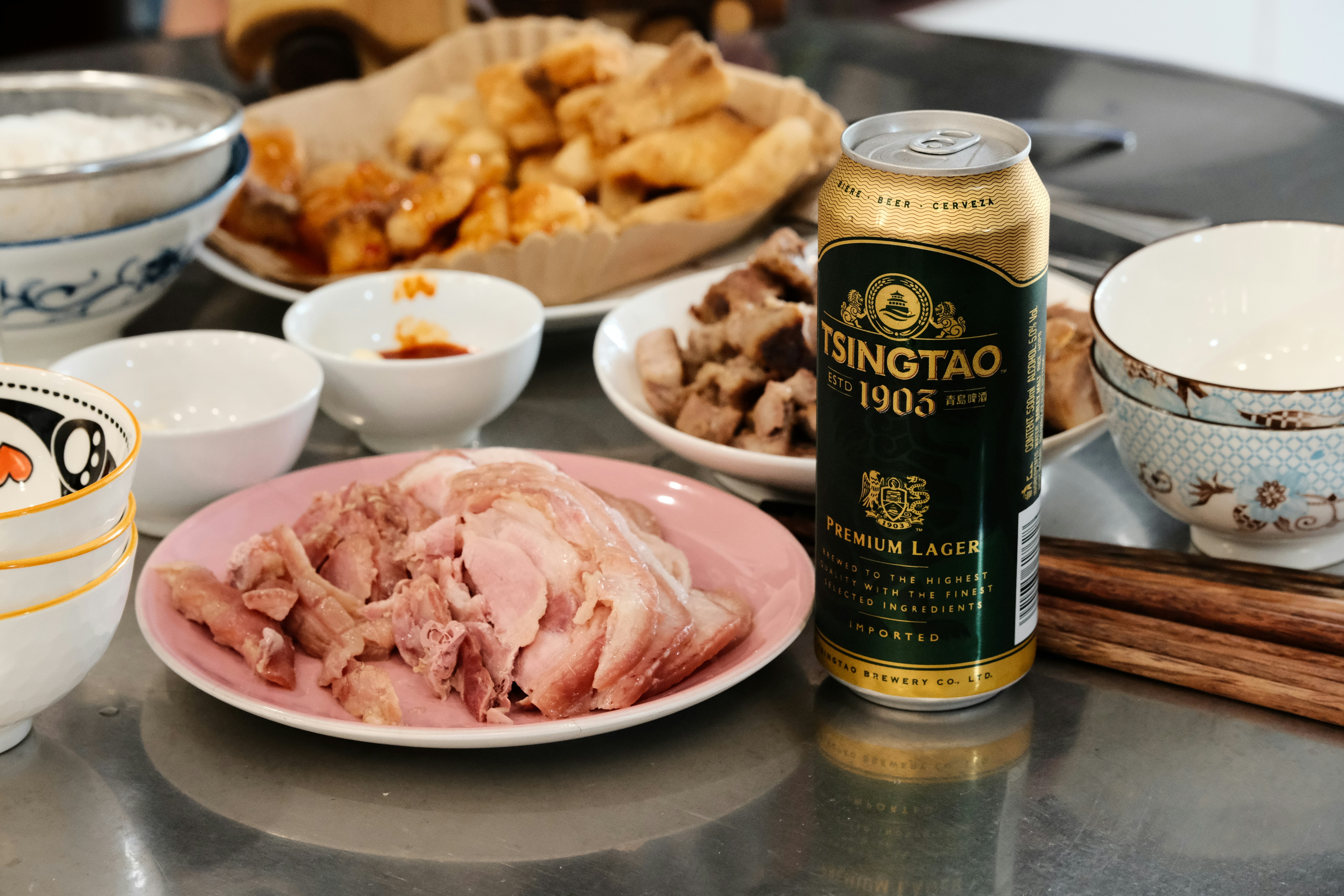 a table topped with plates and bowls filled with food