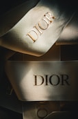 a close up of a pair of shoes with the word dior on it