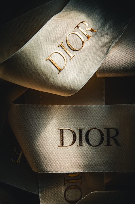 a close up of a pair of shoes with the word dior on it