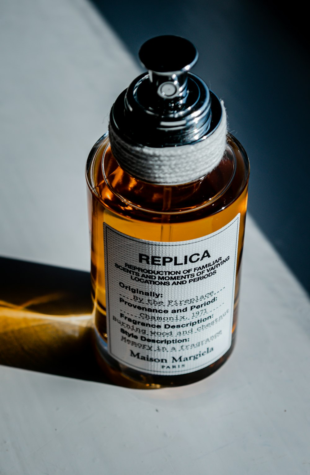 a bottle of perfume sitting on top of a table