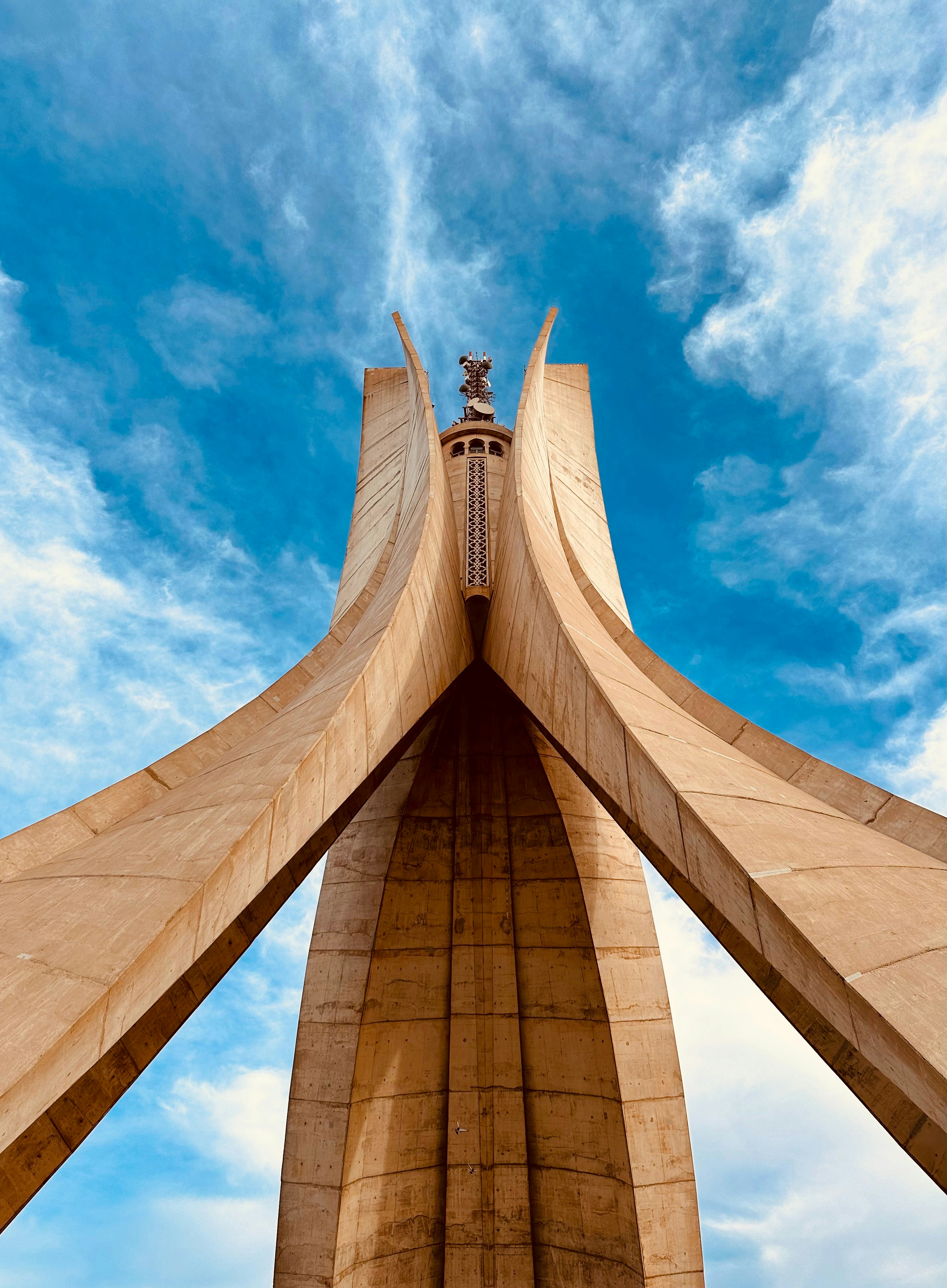 a very tall building with a sky background