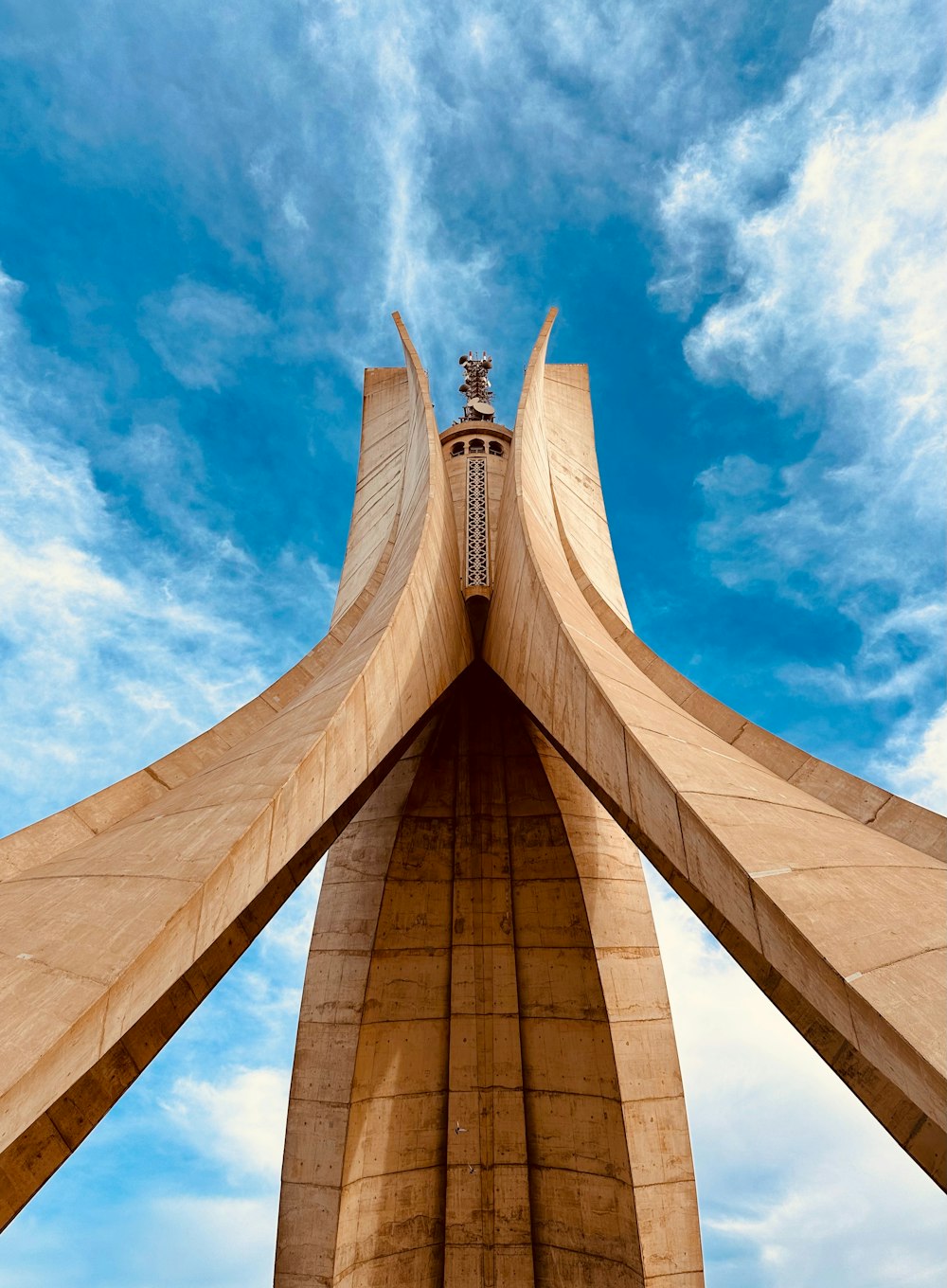 a very tall building with a sky background