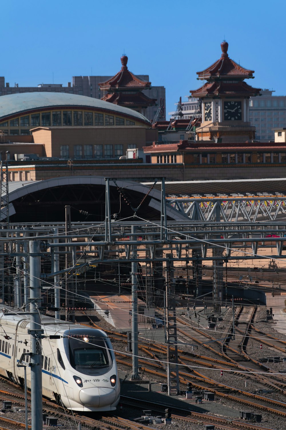 a train on a train track in a city