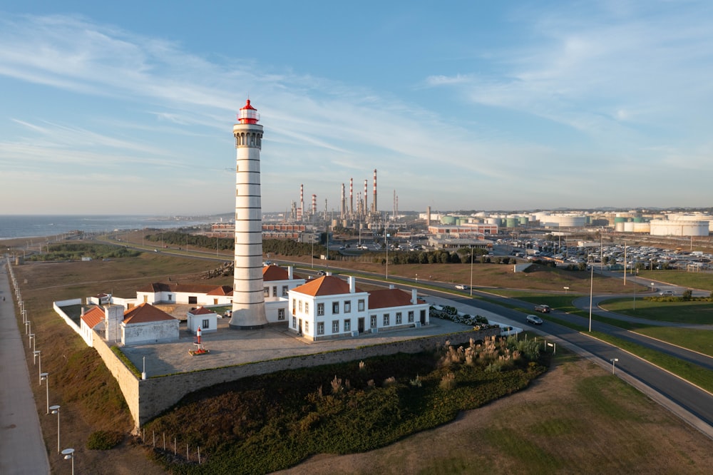 an aerial view of a lighthouse on a small island