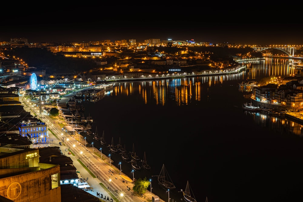 a night time view of a city and a river