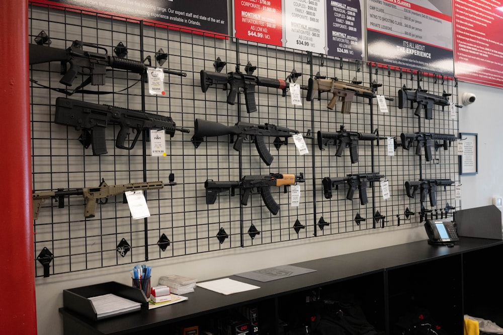 a display of guns on the wall of a gun shop