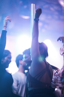 a group of people dancing at a party