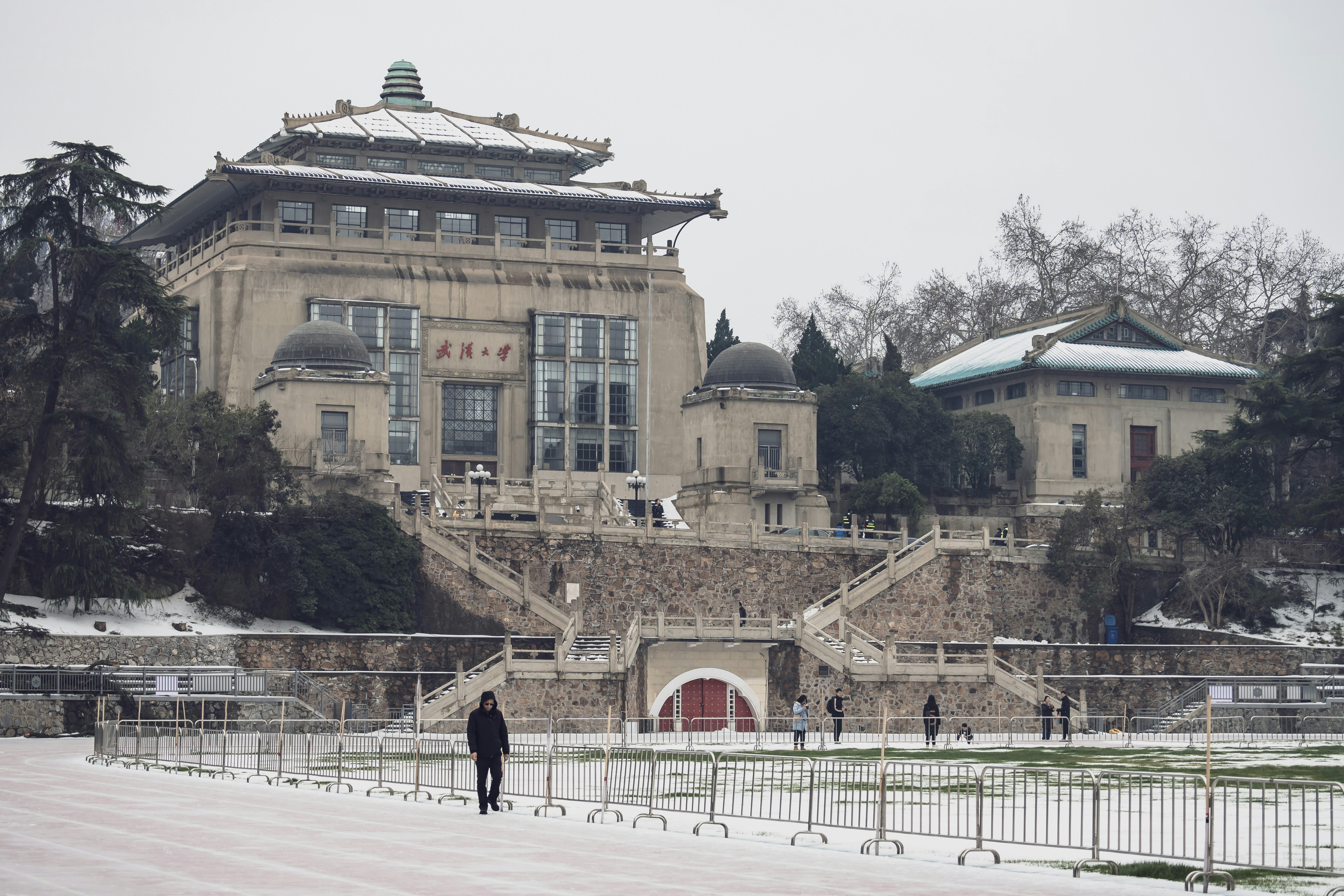 a person standing in front of a large building