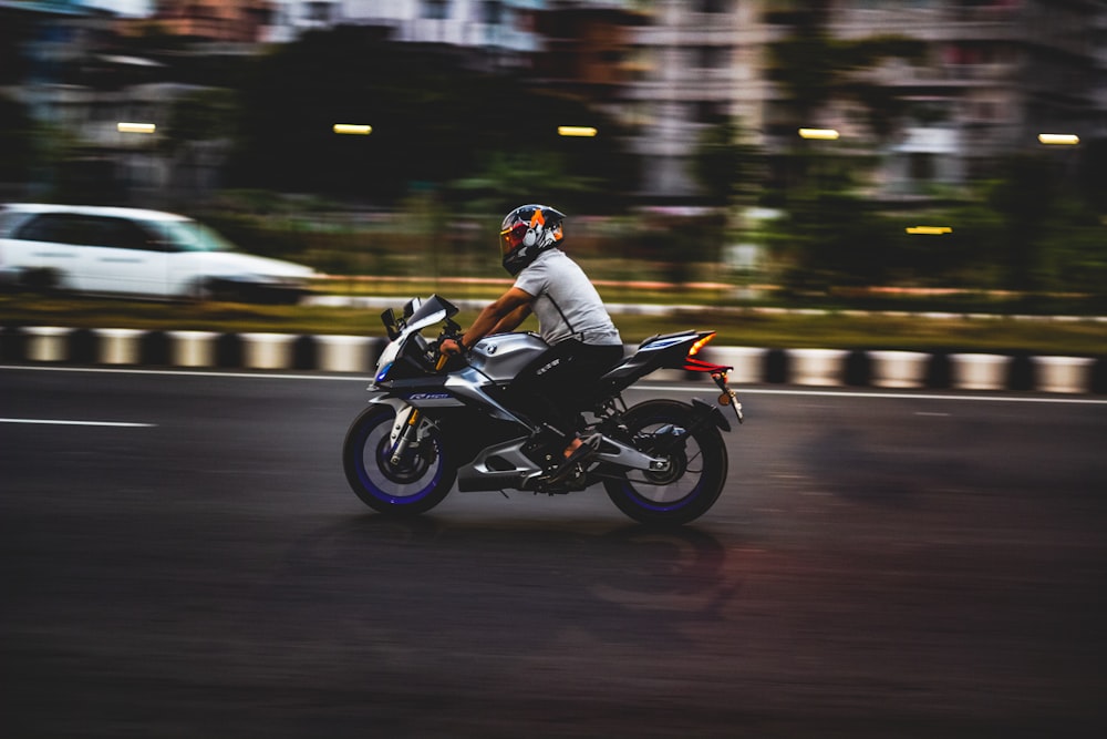 a person riding a motorcycle on a city street