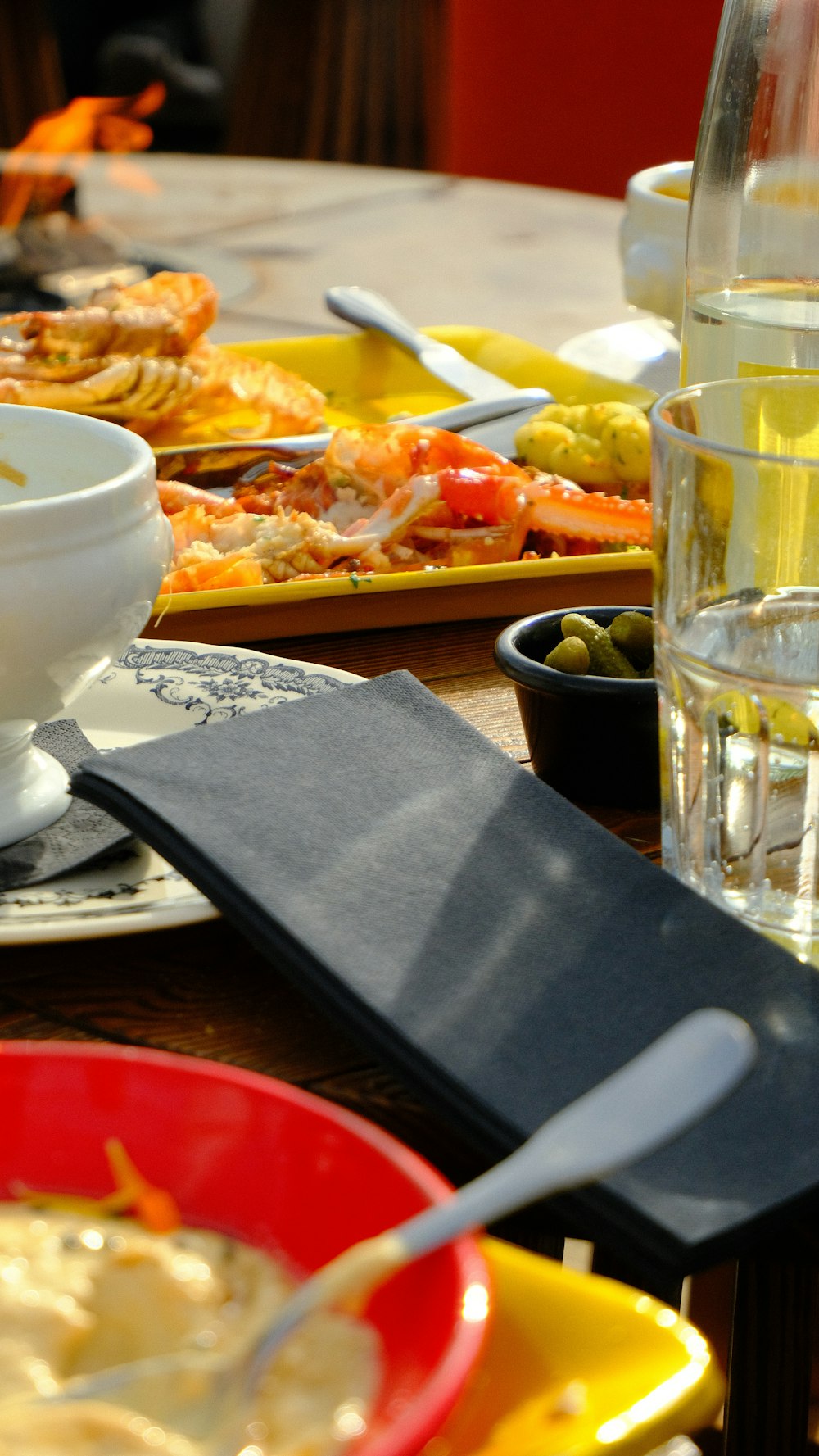 a table topped with plates of food and drinks