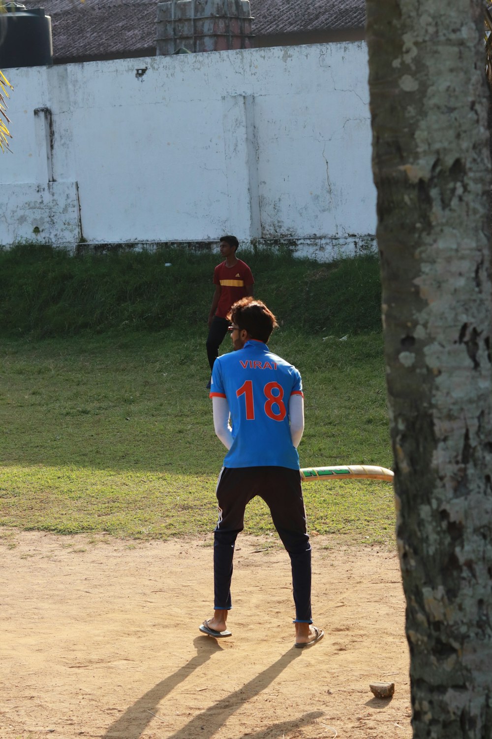 a group of young men playing a game of frisbee