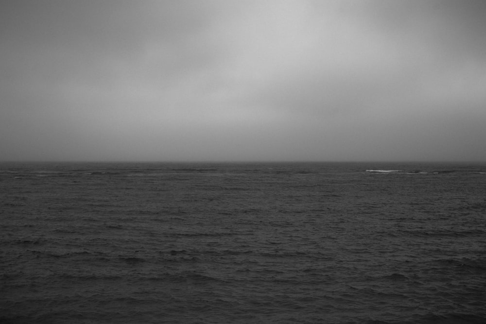 a black and white photo of the ocean