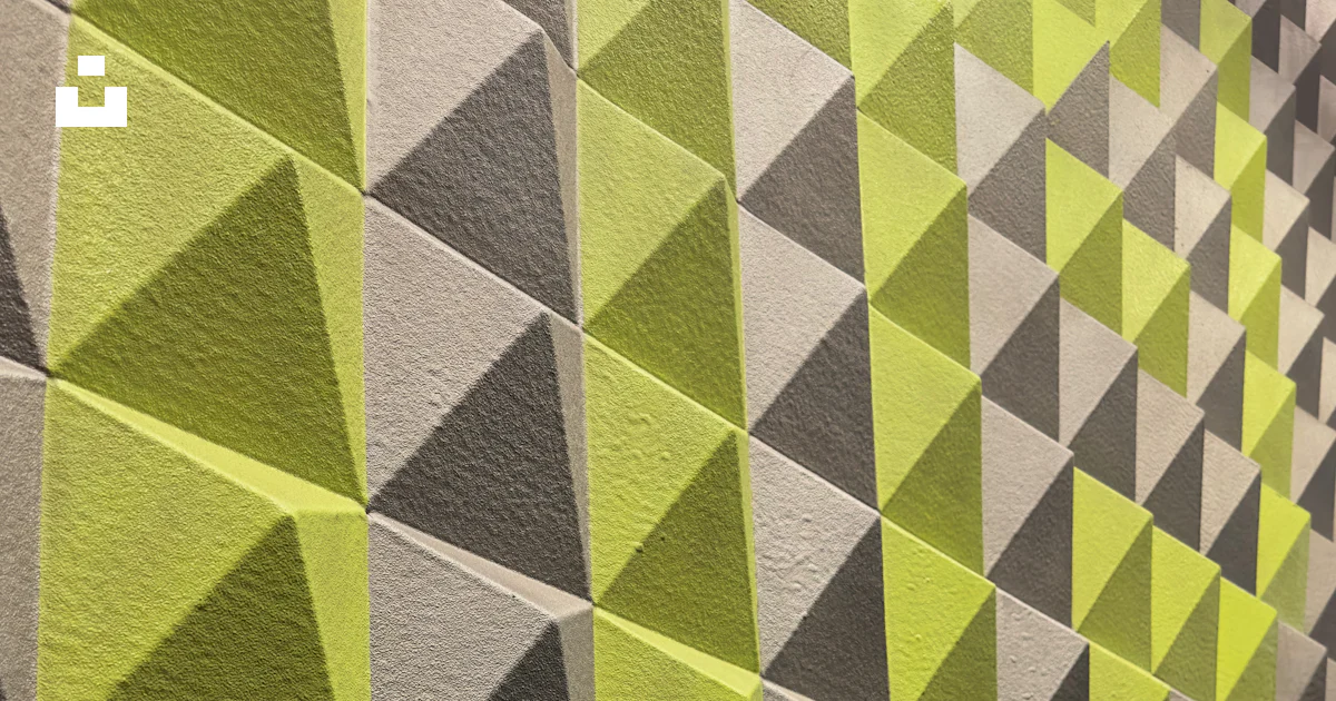 A wall that has a bunch of different shapes on it photo – Free Textura ...