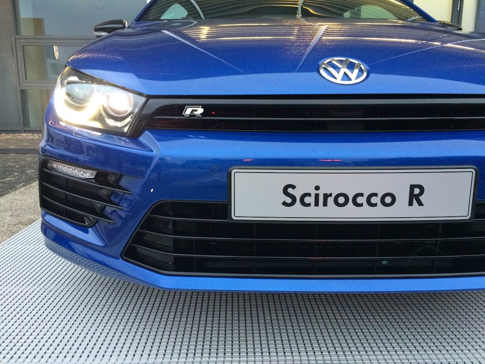 the front of a blue volkswagen scirocco r