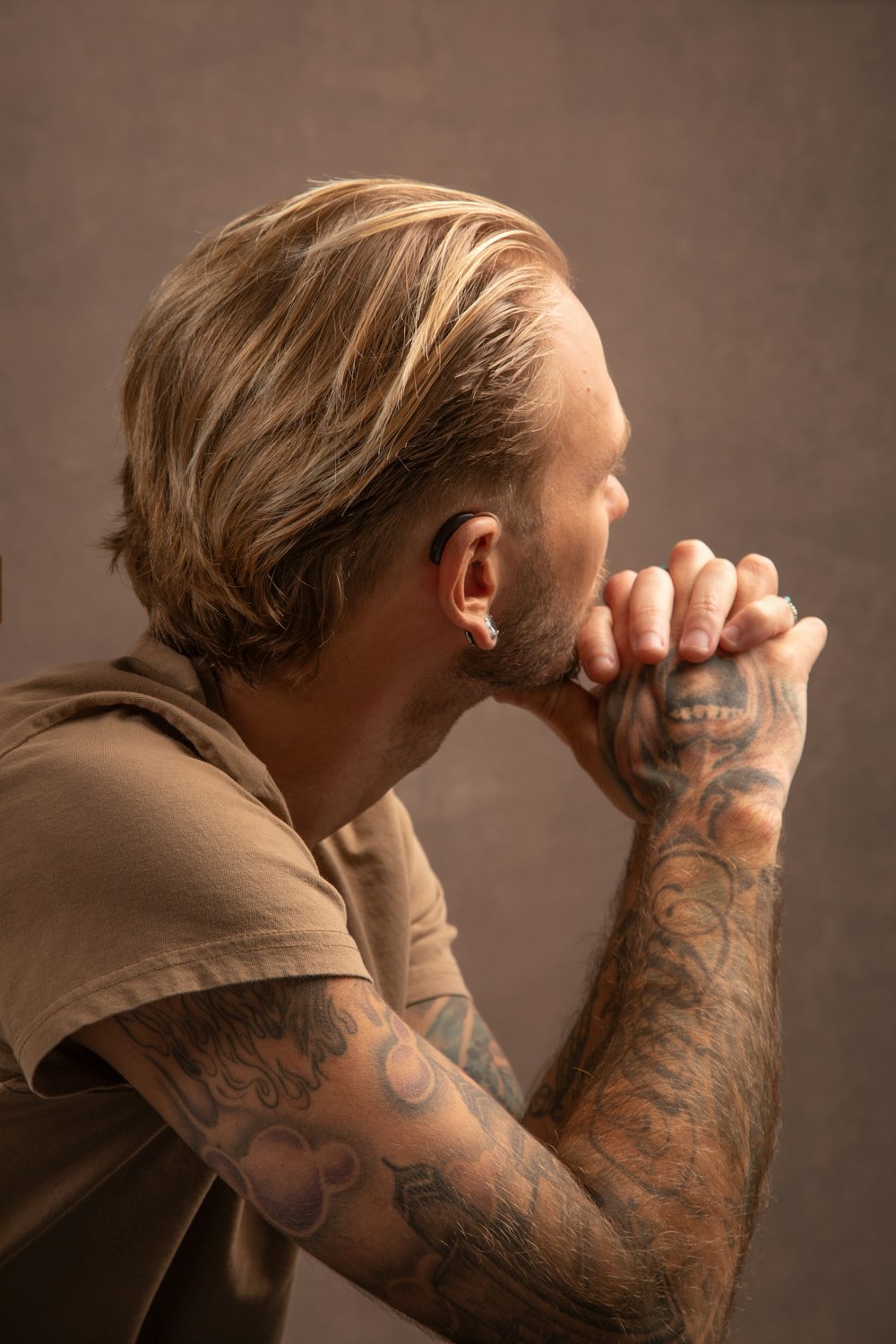 a man with a tattoo on his arm