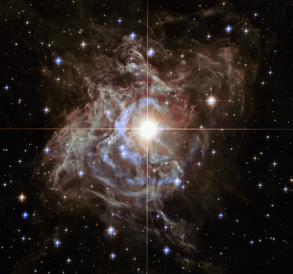 a very large star surrounded by stars in the sky