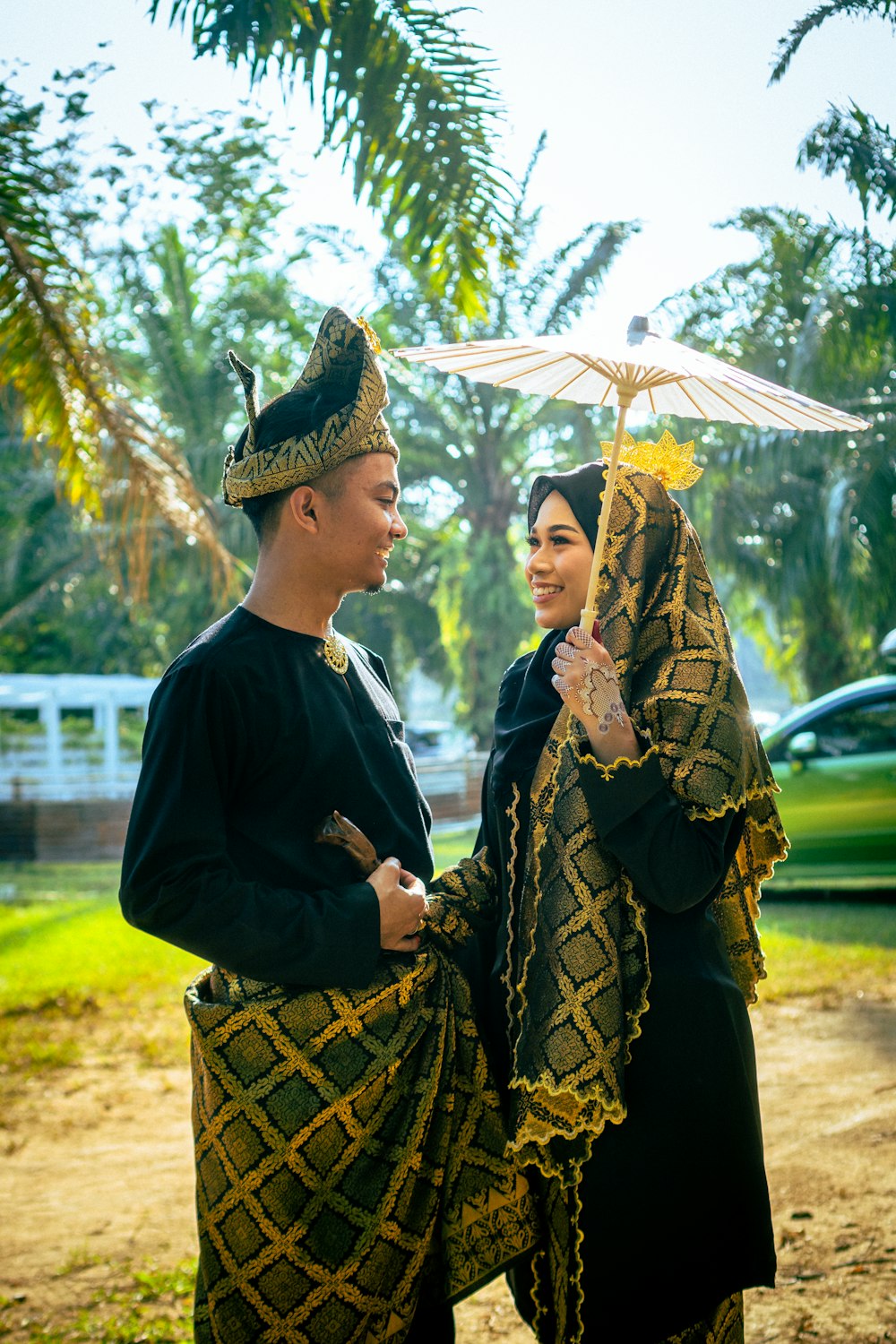 a man and a woman standing under an umbrella