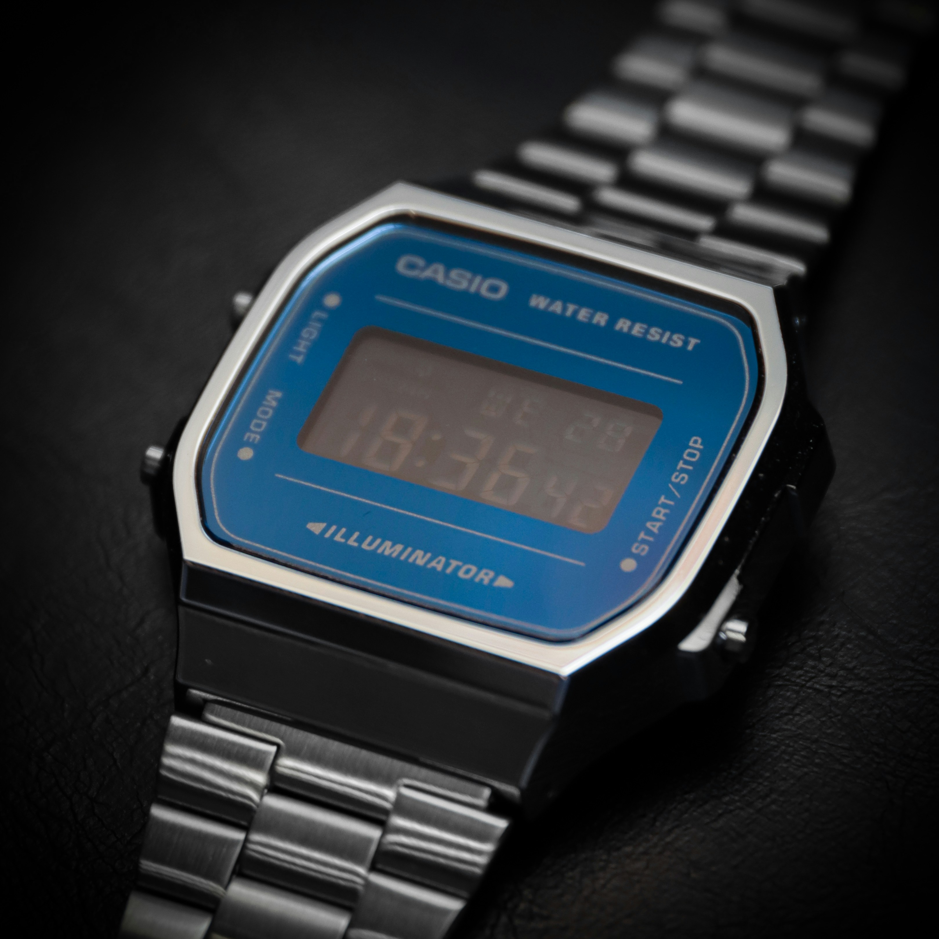 a digital watch sitting on top of a table