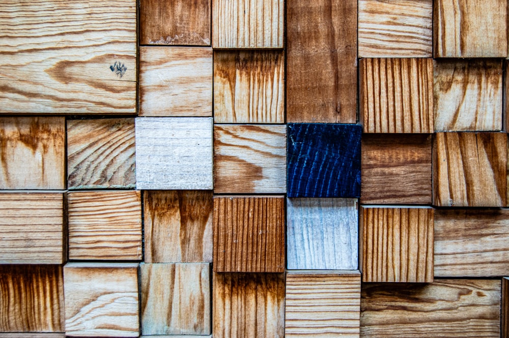 a close up of a wooden wall with different colors