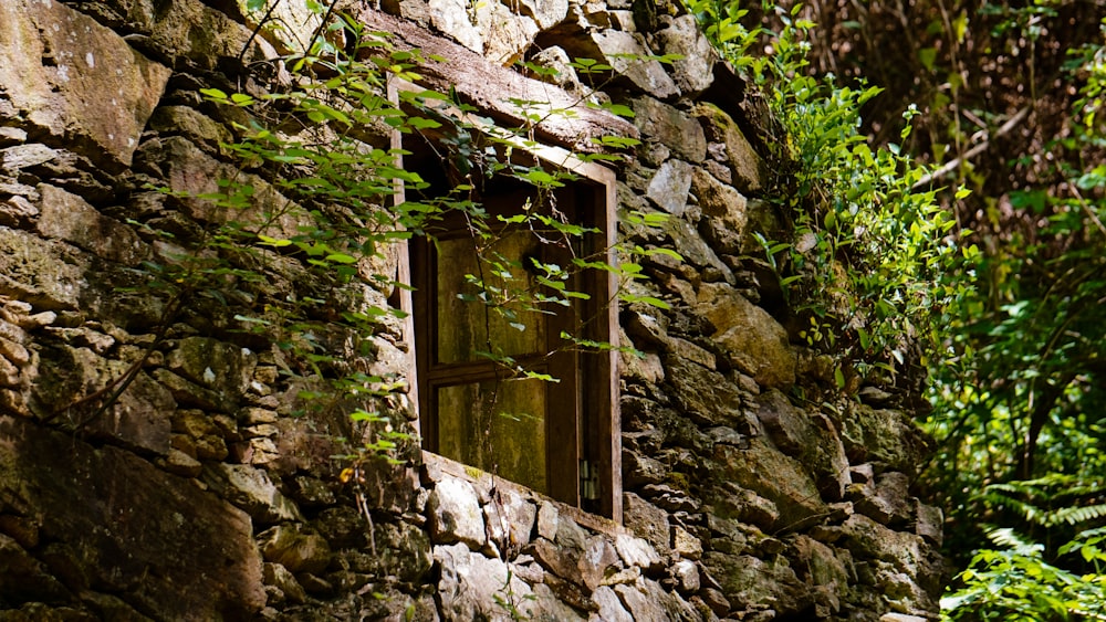 a window in the side of a stone wall