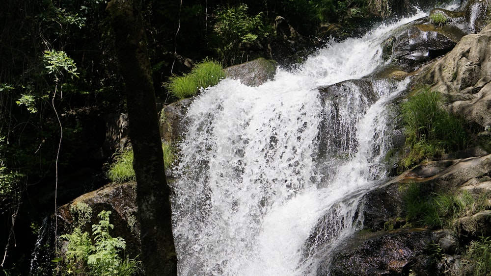 a large waterfall with lots of water coming out of it