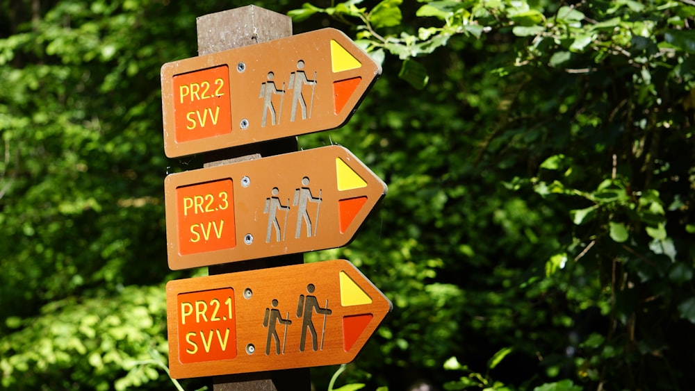 a wooden sign with arrows pointing in different directions