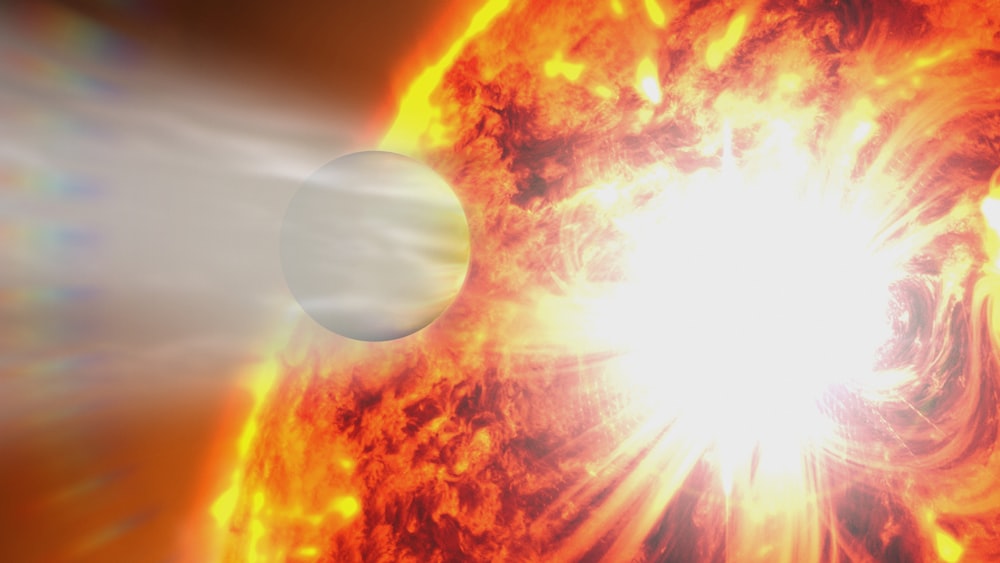 a close up of a bright sun with a white object in the background