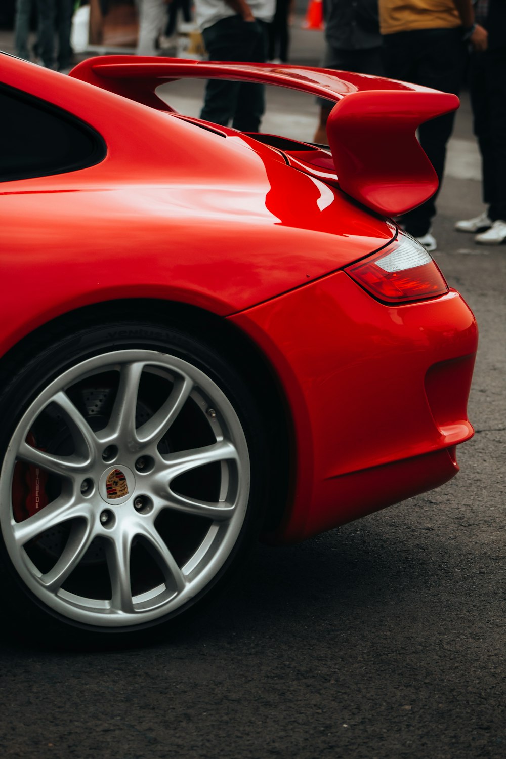 a red sports car parked on the side of the road