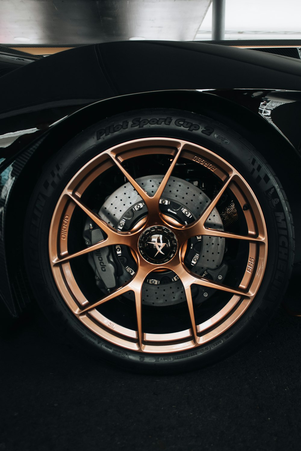 a close up of a car wheel on a black car
