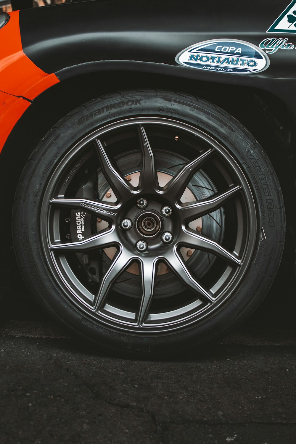 a close up of a tire on a sports car