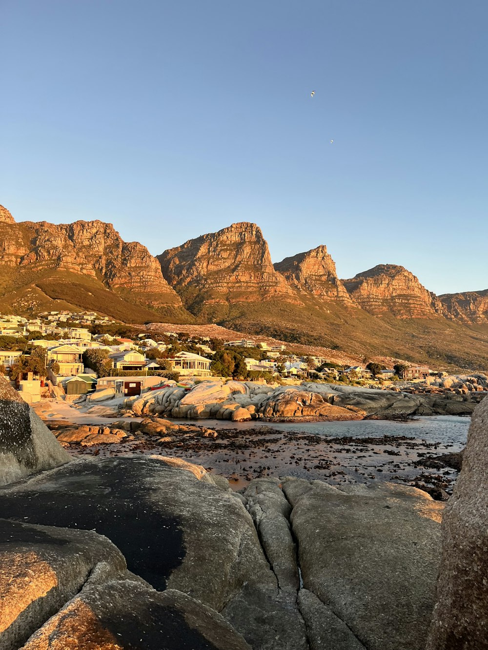 a view of some mountains and a body of water