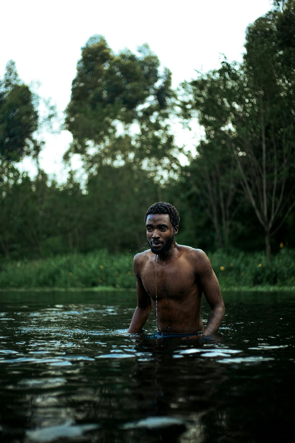 a man standing in a body of water