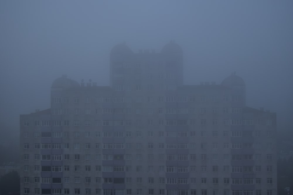 a large white building with a clock on it's side