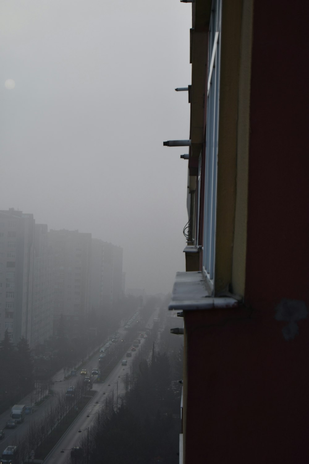 a view of a city in the fog