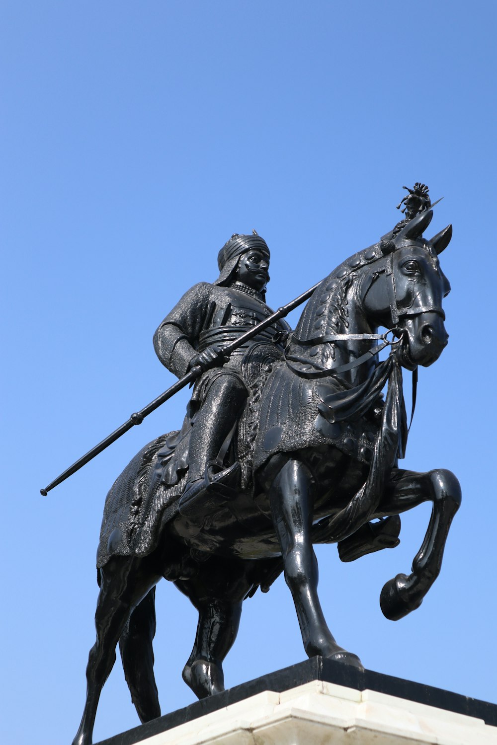 a statue of a man riding a horse