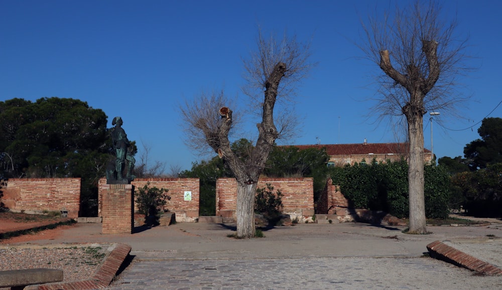 a brick building with a tree in front of it